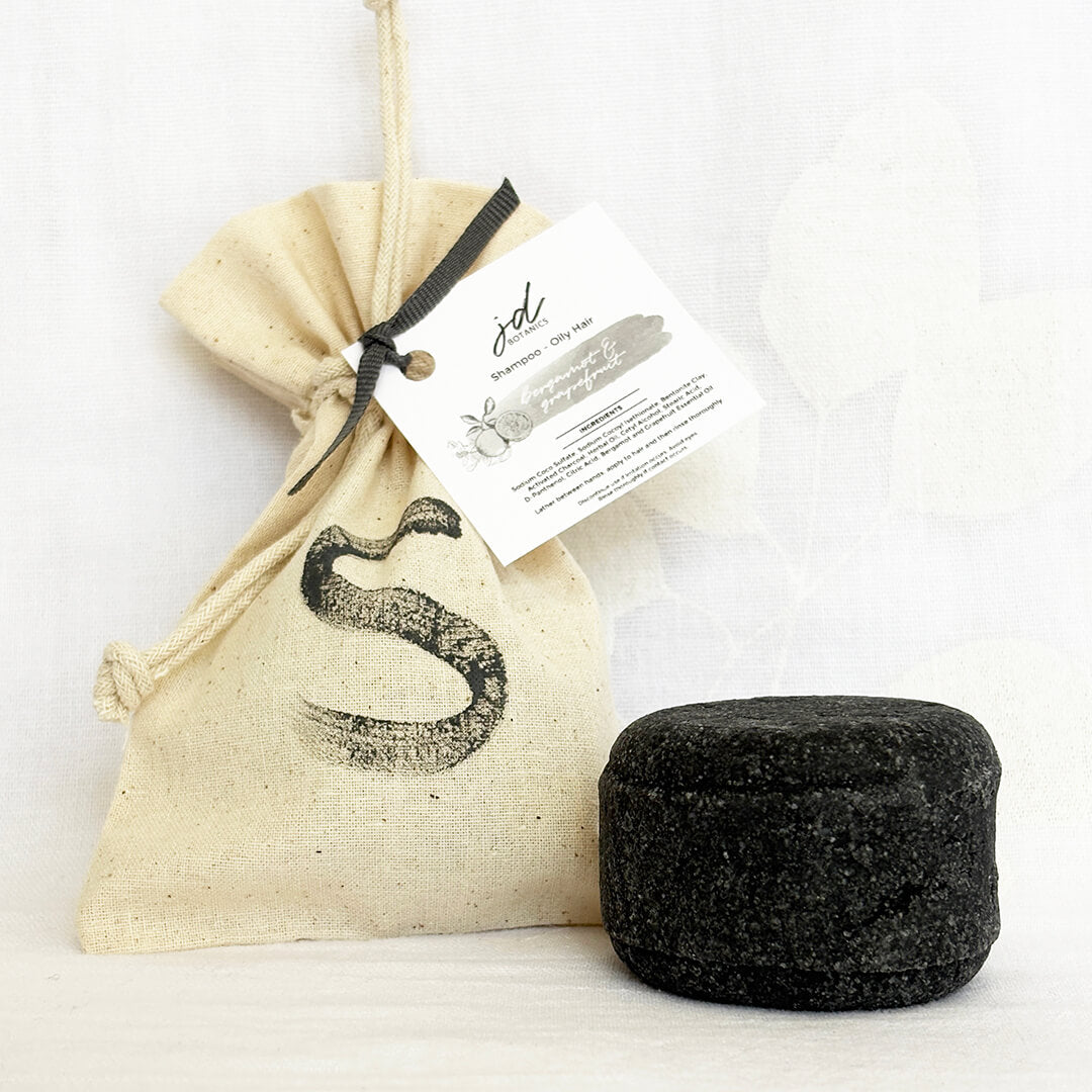 Plastic-free zero waste solid shampoo bar by JDBotanics for oily hair with bergamot and grapefruit