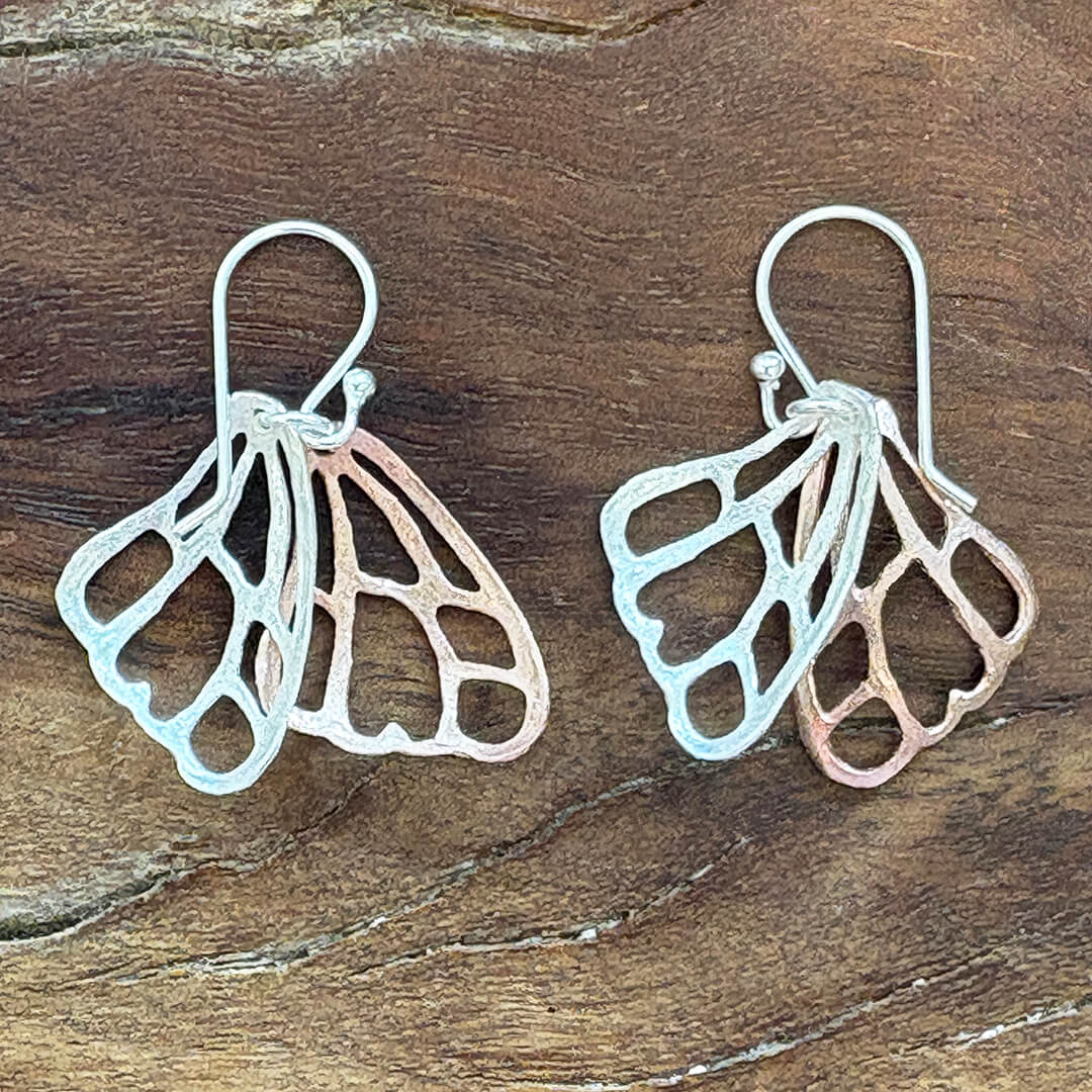 Handmade sterling silver and rose gold butterfly wing earrings with delicate mixed metal artisan design – nature inspired jewelry gift for women