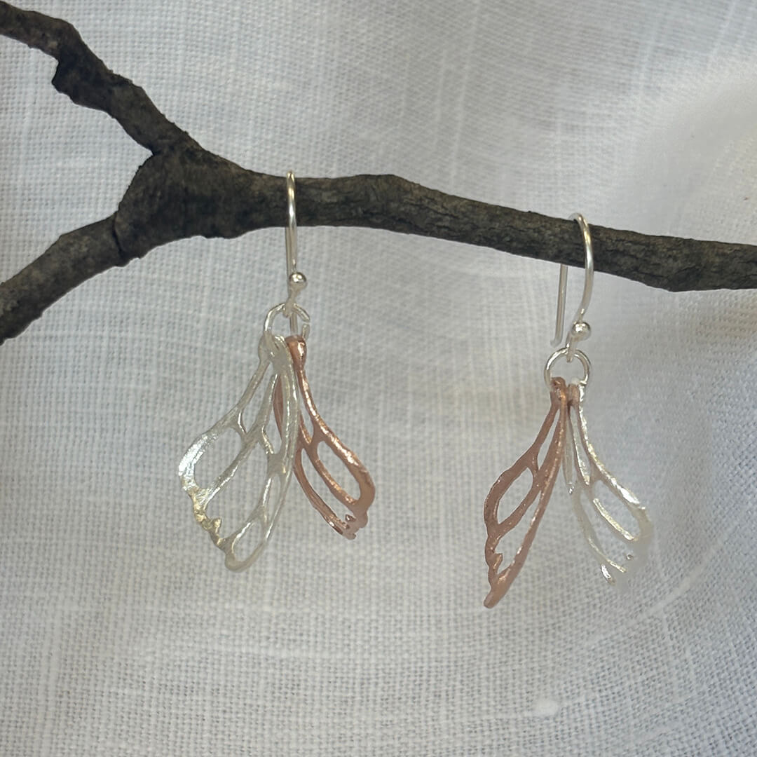 Handmade sterling silver and rose gold butterfly wing earrings with delicate mixed metal artisan design – nature inspired jewelry gift for women